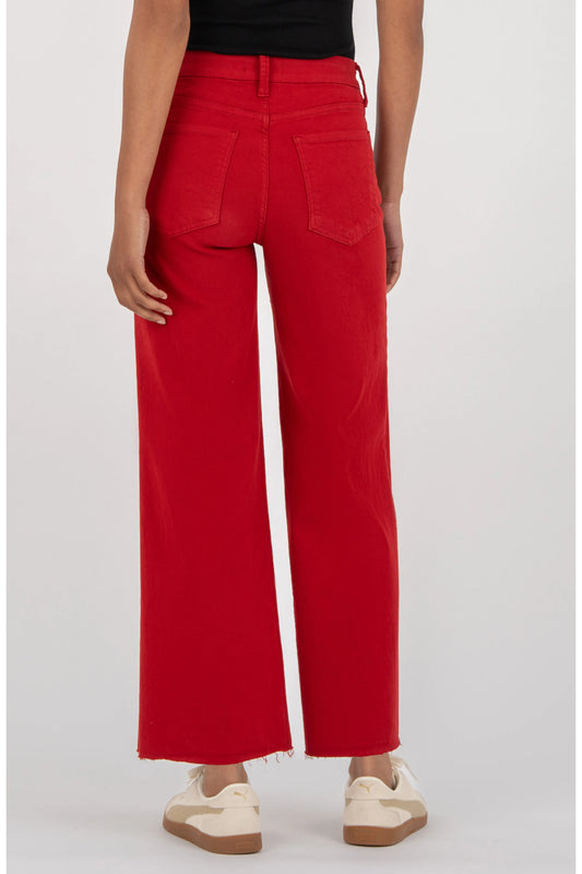 Kut Meg Fab Ab Wide Leg Jeans in Ruby Red — back view, high waist, raw hem, two back pockets, worn with white sneakers.