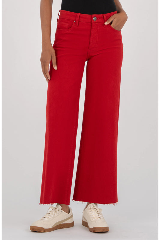 Kut Meg Fab Ab Wide Leg Jeans in Ruby Red, high waist, raw hem, front view on model with white sneakers.