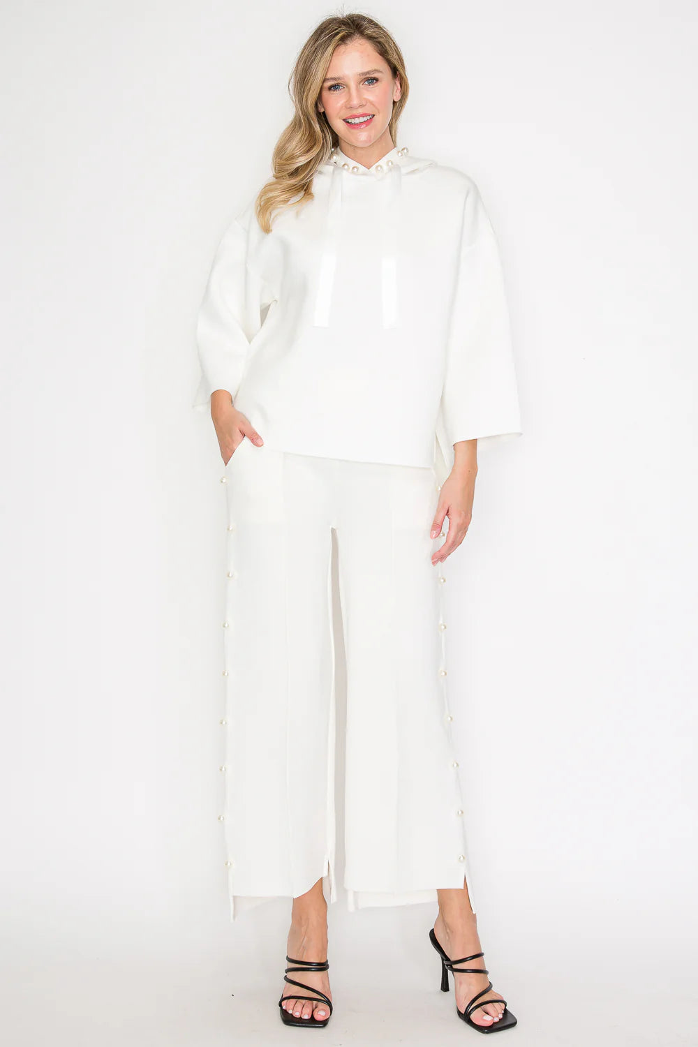 Joh Apparel Francine French Scuba Pearl Hoodie in white, front view on model, paired with matching wide-leg pearl-trim pants.