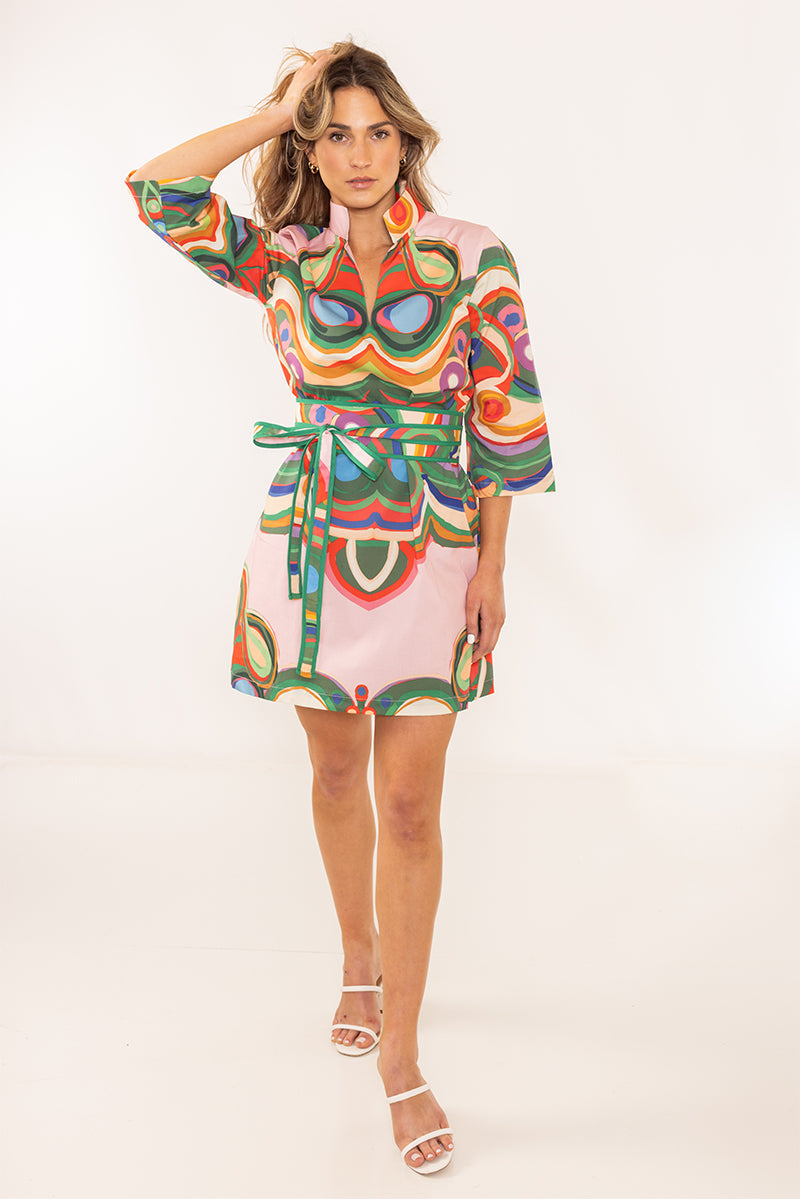 House of MBR Venice Obi Belt styled over a vibrant multicolor psychedelic print mini dress, worn by a model, front view.