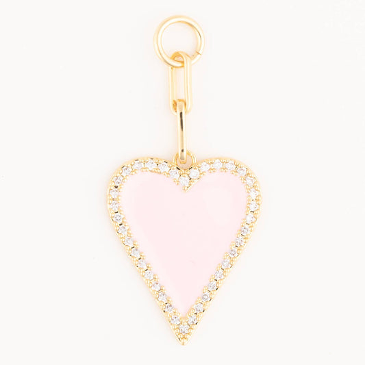 Michelle McDowell Charm Luxe Blush Heart — gold pendant with pale pink enamel center and crystal pavé border, front view.