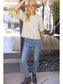 The Willow Bloom scalloped hem cream knit top with puff sleeves, styled with jeans and ankle boots.