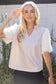 The Faux Feather Top Cream by The Faux Feather featuring fluffy feather-textured sleeves and a v-neckline.
