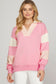 SHE+SKY Color Block French Terry Sweatshirt in pink with cream panels, striped collar, and raw-edge details, front view on model.