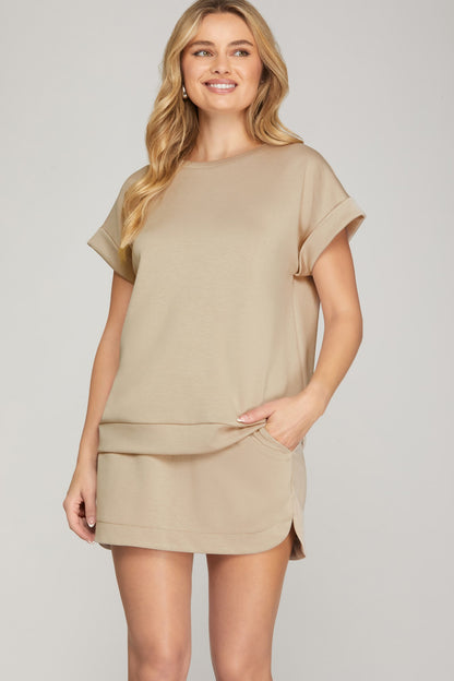 SHE+SKY High Waist Skort with Pockets in tan, front view on model, paired with matching top, side pockets visible.