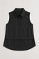 Caroline sleeveless black collared shirt with button placket and layered hem detail.