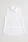 Caroline sleeveless white button-front collared shirt with curved hem and structured bodice paneling.