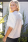 The Faux Feather Top Cream by The Faux Feather, featuring textured feathery sleeves and a smooth woven back.