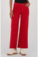 Kut Meg Fab Ab Wide Leg Jeans in Ruby Red, high waist, raw hem, front view on model with white sneakers.