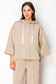 Joh Apparel Farrah French Scuba Pearl Pant in Taupe, featuring wide-leg trousers with pearl button side detailing, paired ...