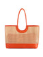 Lyra Tote bag featuring woven rattan body with orange leather handles, trim, and structured base.
