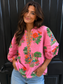 Maude Vivante Raya Top in pink with vibrant floral botanical print, V-neckline, and puffed sleeves.