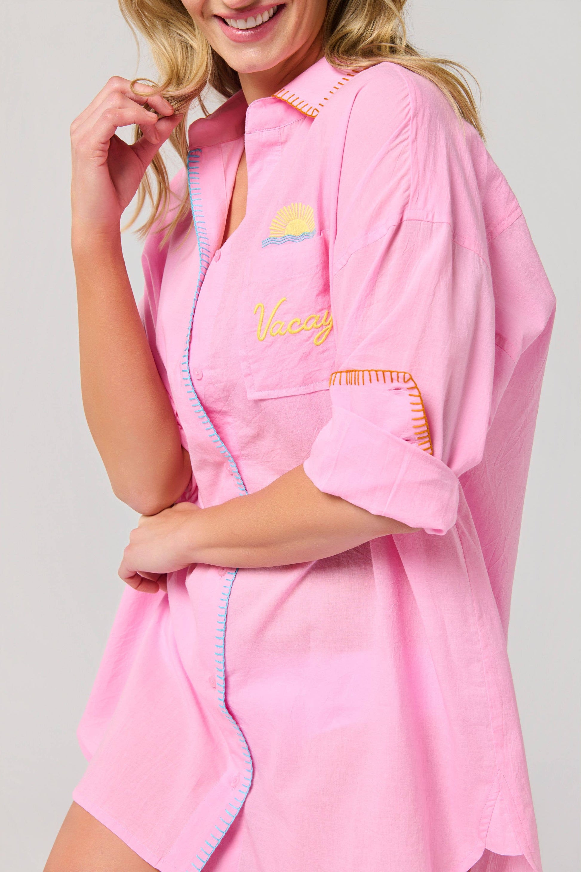 Vacay Out Of Office pink button-up cover-up shirt with embroidered sunset graphic and "Vacay" script, rolled sleeves, colo...