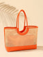 Lyra Tote bag featuring woven rattan body with orange leather trim, handles, and structured base.