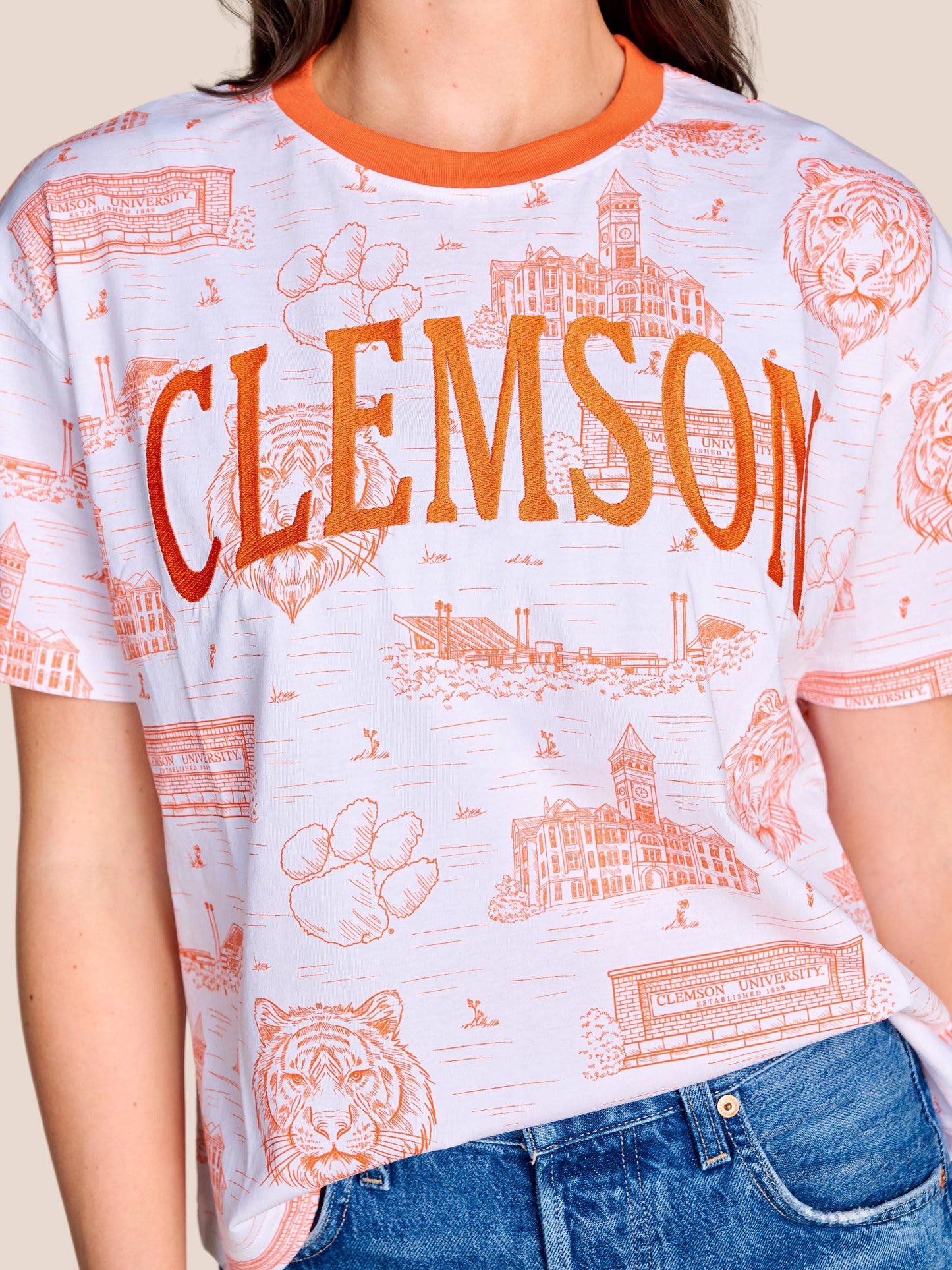 Stewart Simmons Team Toile Embroidered Tee Clemson, white ringer tee with orange all-over campus toile print and embroidered CLEMSON lettering.