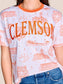 Stewart Simmons Team Toile Embroidered Tee Clemson, white ringer tee with orange all-over campus toile print and embroidered CLEMSON lettering.