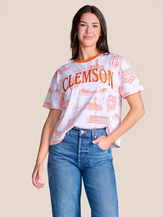 Stewart Simmons Team Toile Embroidered Tee Clemson — white tee with orange toile campus print, tiger graphics, and embroidered CLEMSON text, front view on model.