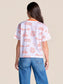 Stewart Simmons Team Toile Clemson Tee, back view, white tee with orange tiger and campus toile print, orange collar, worn with jeans.