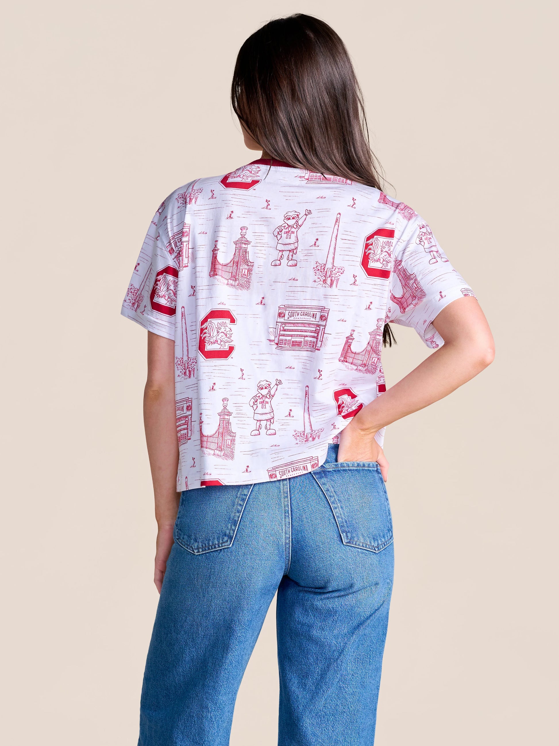 Stewart Simmons white crop tee featuring all-over South Carolina Gamecocks toile print, shown from the back, paired with b...
