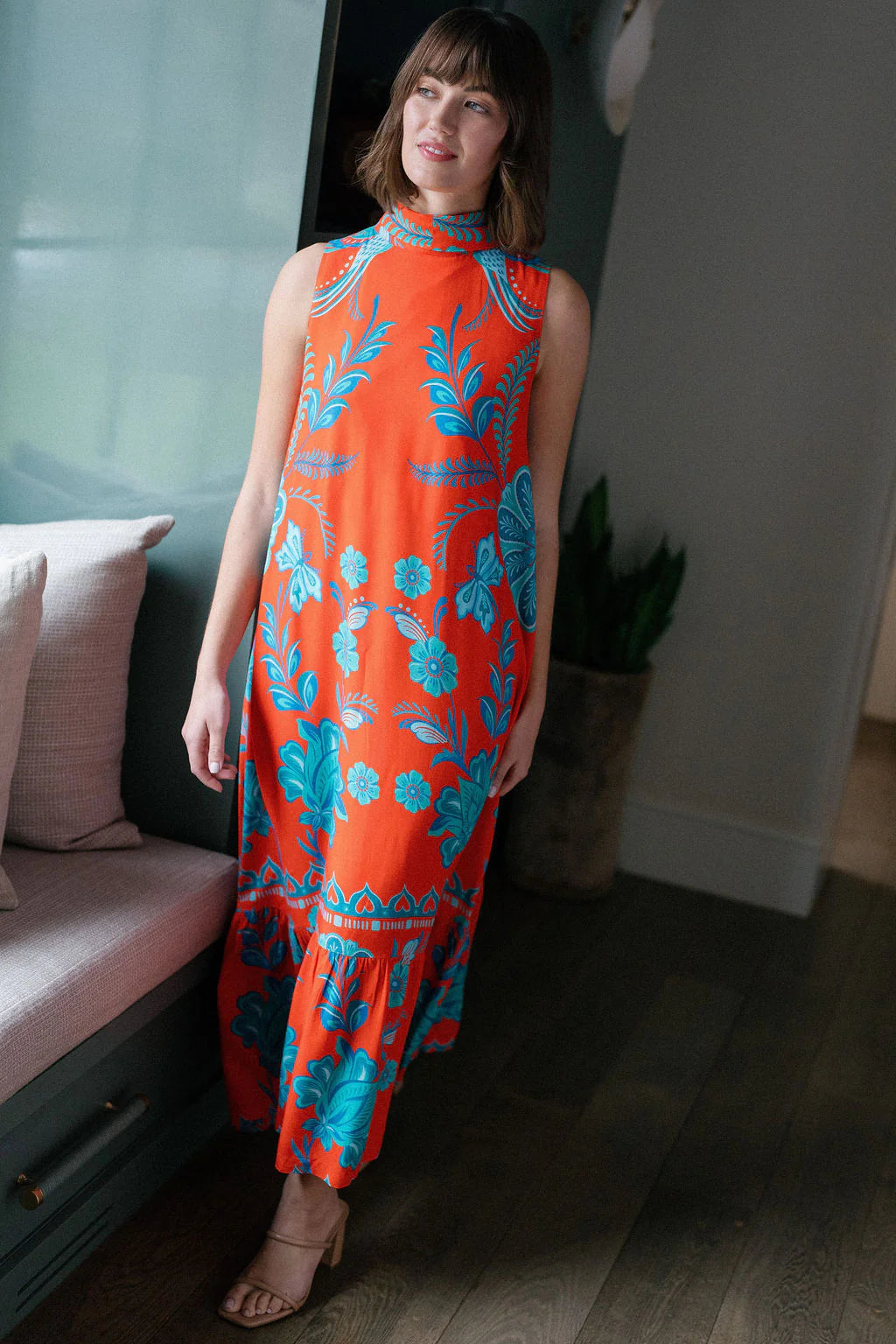 Briton Court Strawberry Waves Charlie Maxi Dress featuring bold floral print, mock neck, sleeveless silhouette, and ruffle...