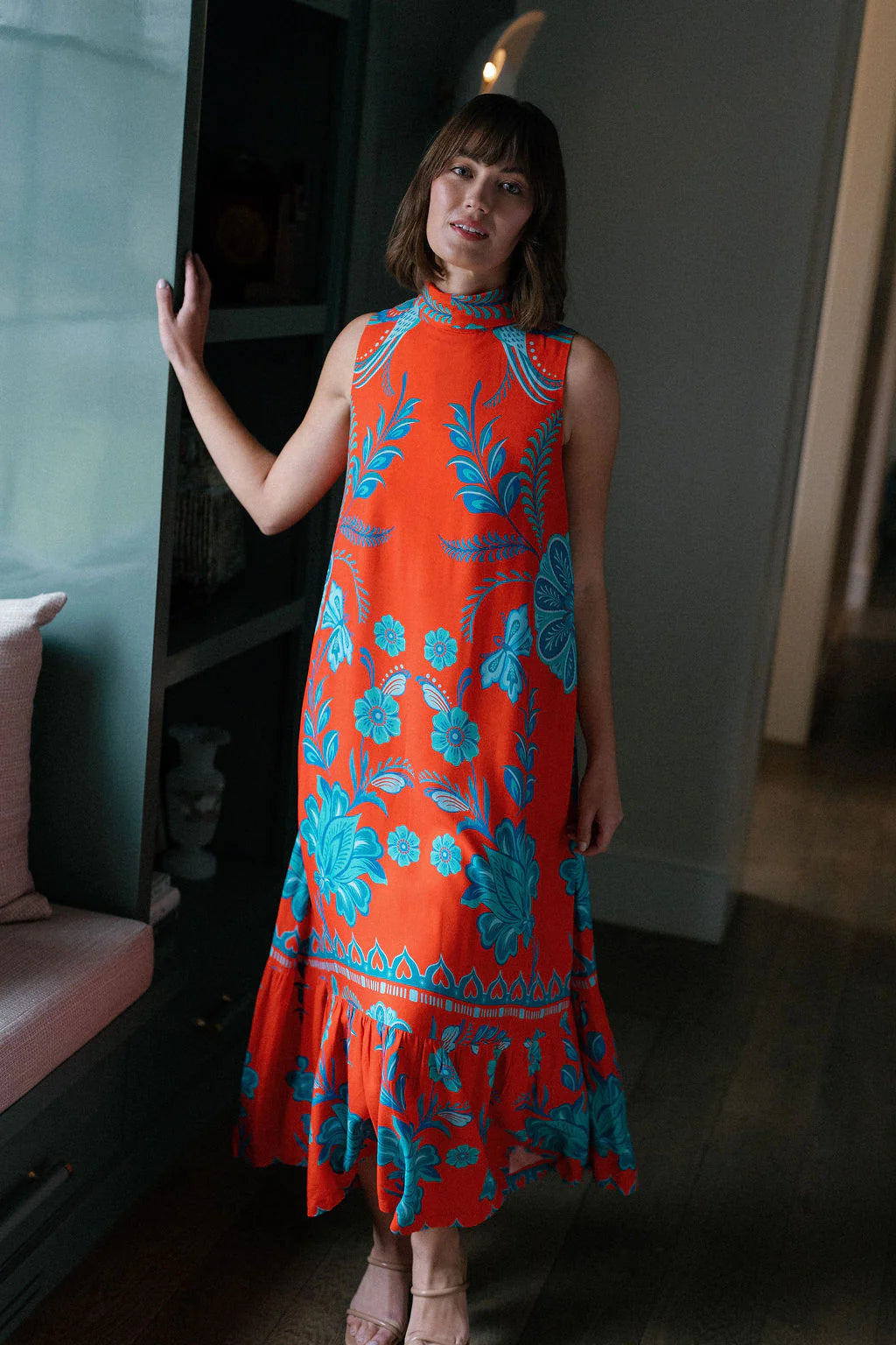 Briton Court Strawberry Waves Charlie Maxi Dress featuring bold floral print, mock neck, sleeveless silhouette, and ruffle...