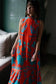 Briton Court Strawberry Waves Charlie Maxi Dress featuring bold floral print, sleeveless silhouette, mock neck, and tiered...