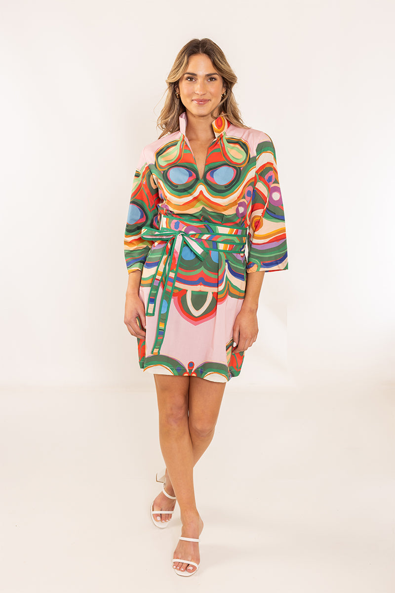 House of MBR Venice Obi Belt worn by model over a colorful abstract-print mini dress with green, red, and blue tones.