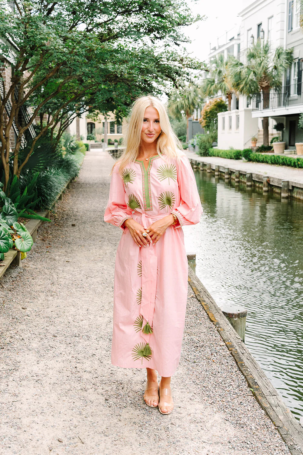 Victoria Dunn Quinn Dahlia pink midi dress with green embroidered palm leaf motifs and long balloon sleeves.