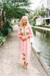 Victoria Dunn Quinn Dahlia pink midi dress with green embroidered palm leaf motifs and long balloon sleeves.