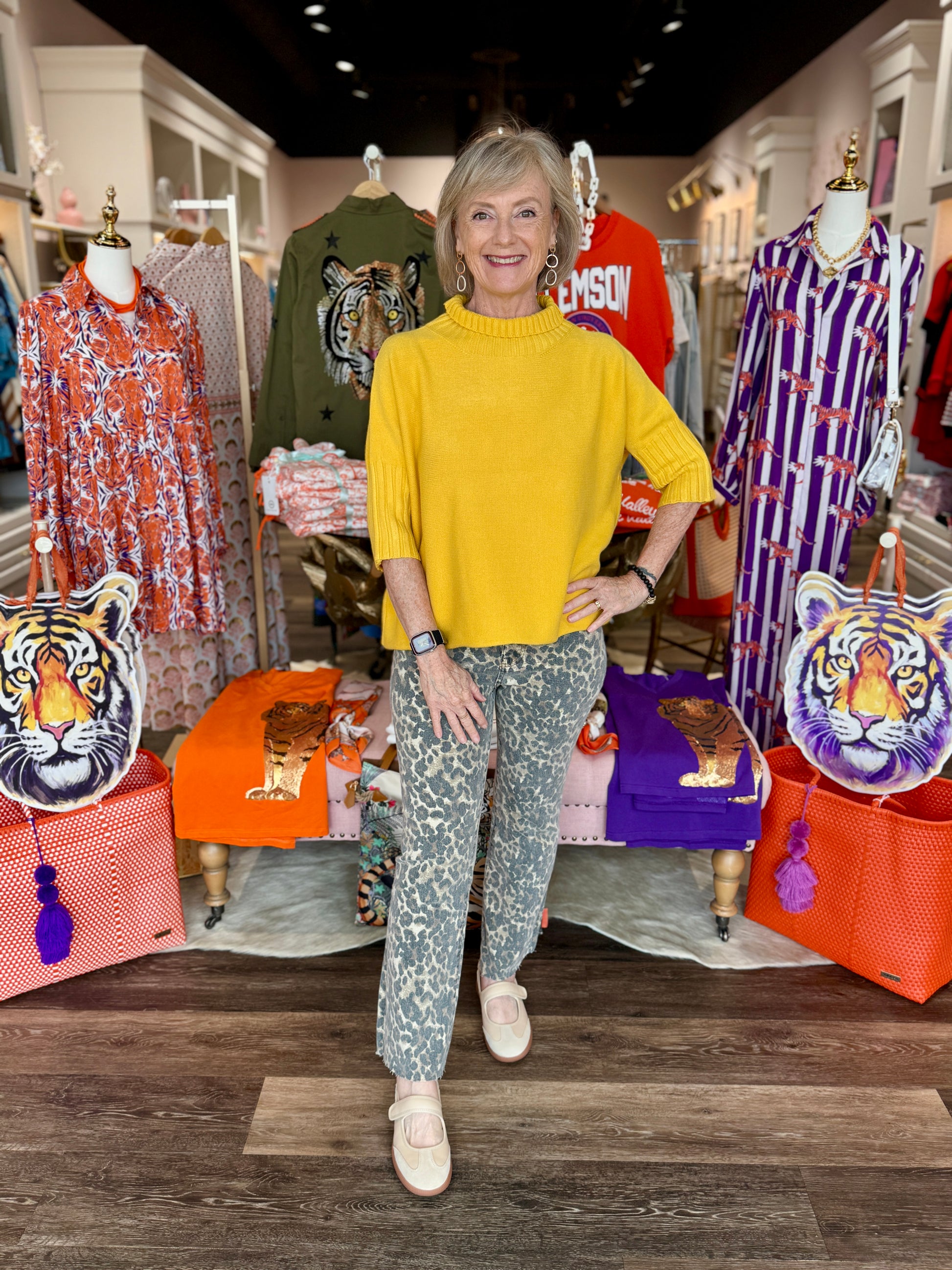 Maple Mockneck Sweater in mustard yellow with ribbed collar and short flutter sleeves, styled with leopard print jeans.