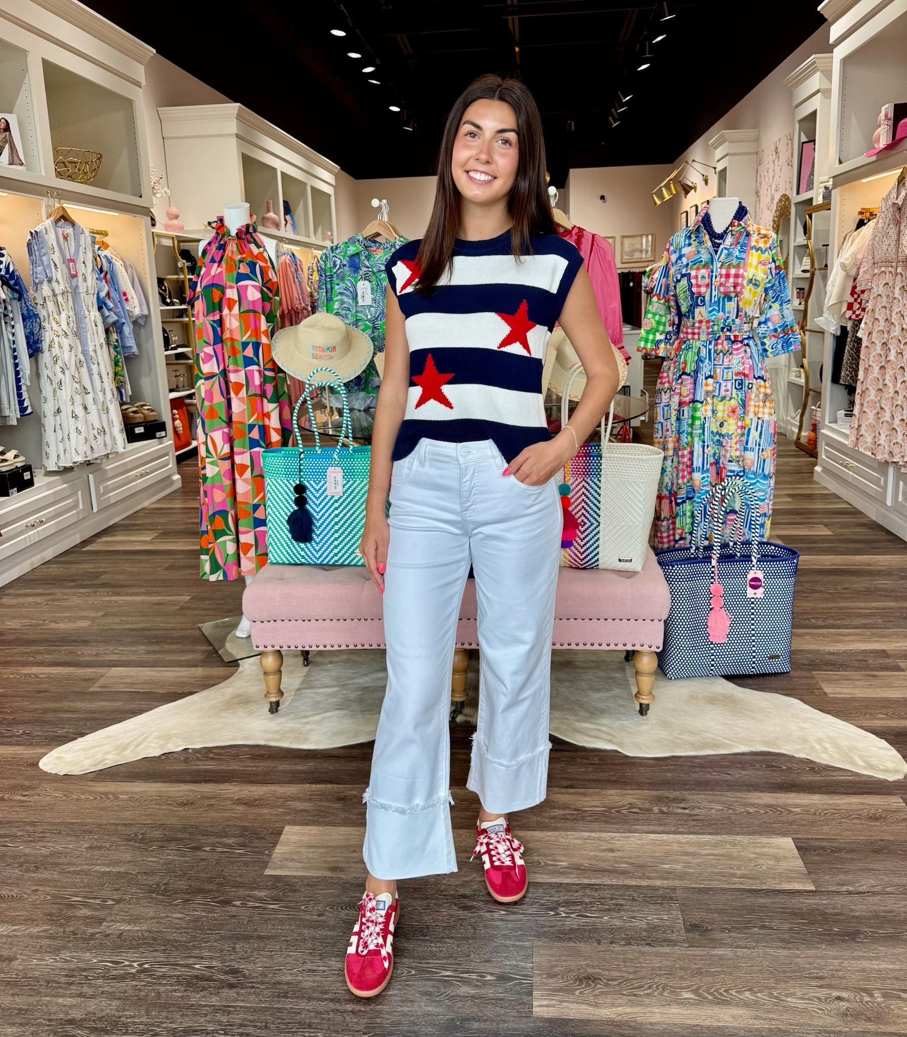 Stars and Stripes knit sweater vest featuring navy and white horizontal stripes with bold red star embroidery.