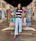 Stars and Stripes knit sweater vest featuring navy and white horizontal stripes with bold red star embroidery.