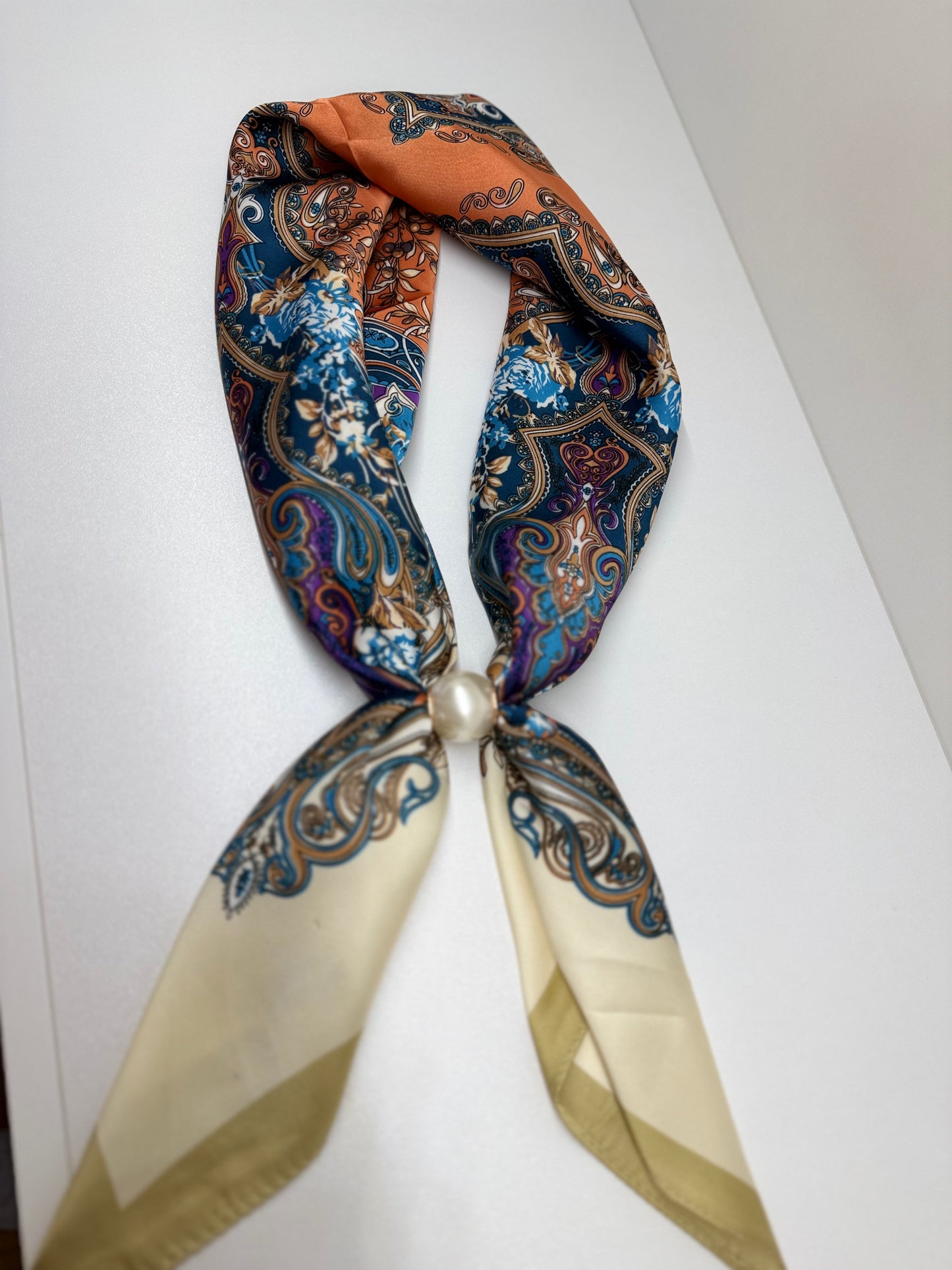 Ready To Wear magnetic scarf with paisley floral print, gathered and secured with a pearl accent ring.