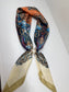 Ready To Wear magnetic scarf with paisley floral print, gathered and secured with a pearl accent ring.