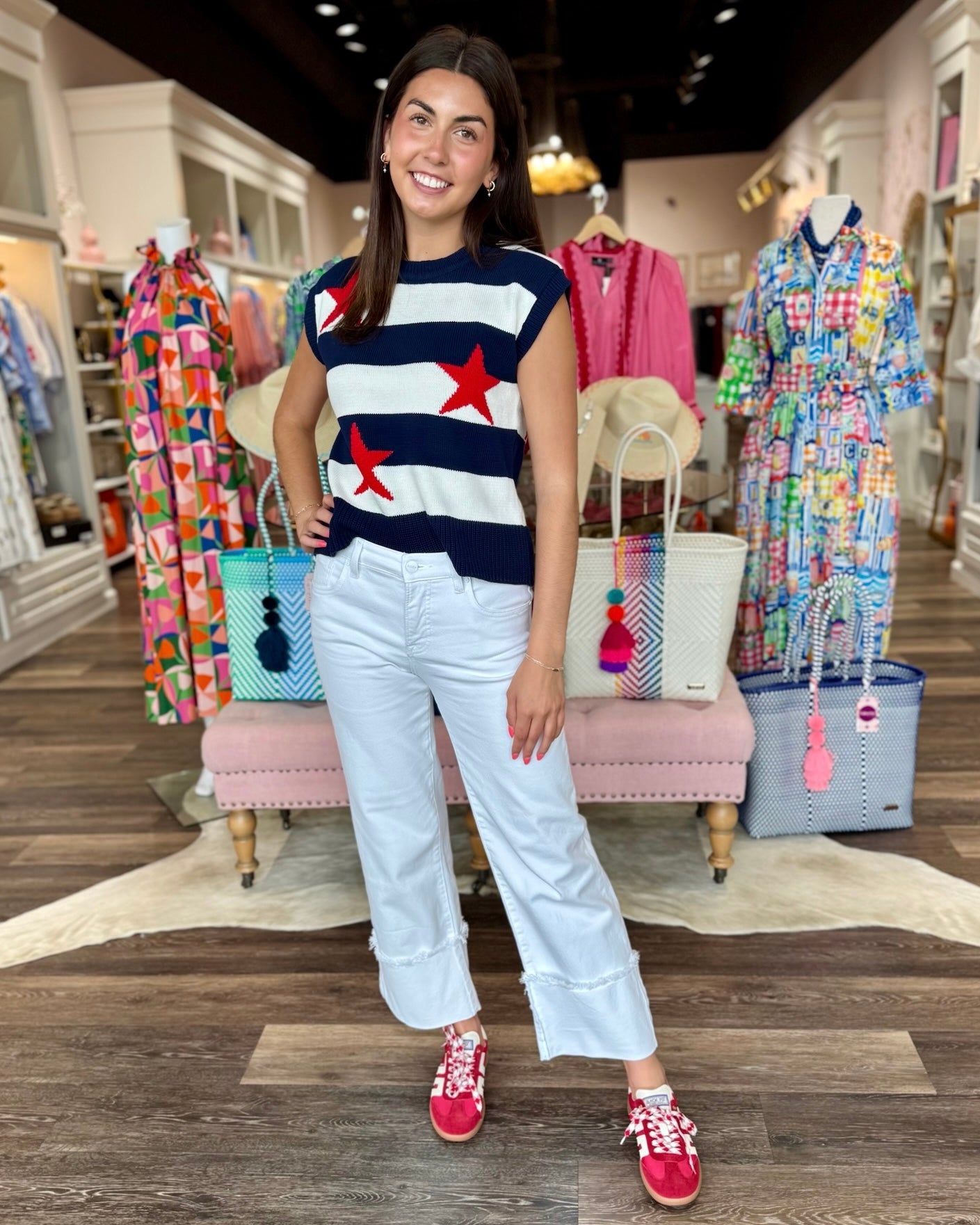 Stars and Stripes knit sweater vest featuring navy and white horizontal stripes with red star accents, styled with white w...