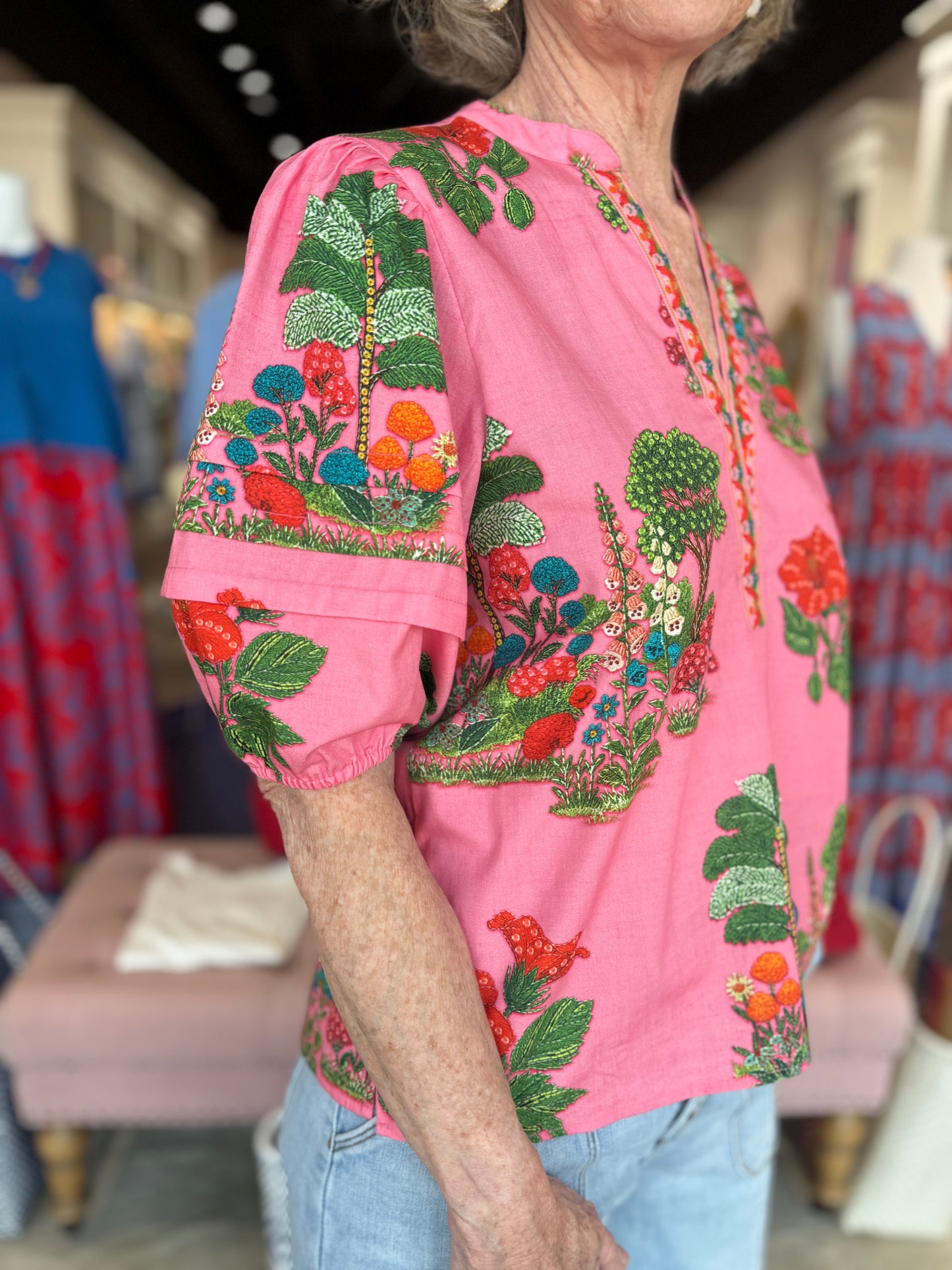 Maude Vivante Raya Top in pink with vibrant embroidered botanical garden print and puffed short sleeves.