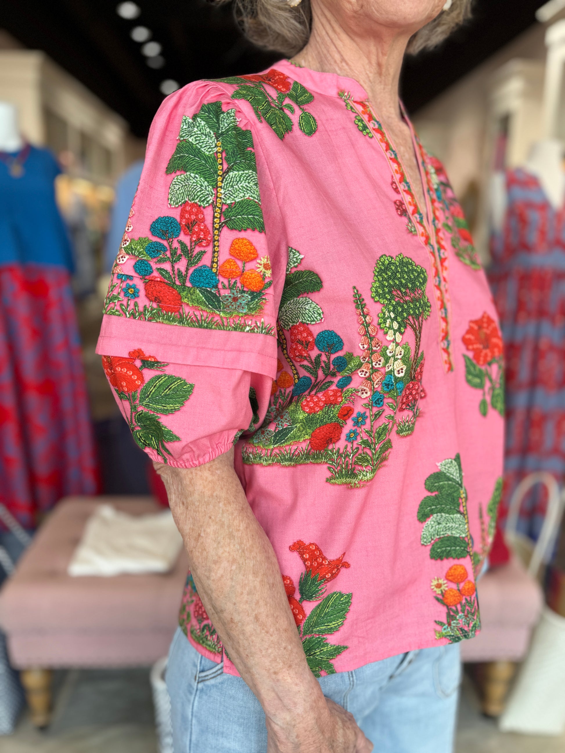 Maude Vivante Raya Top in pink with vibrant embroidered botanical garden print and puffed short sleeves.
