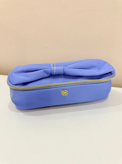 Mary Square Kiss & Makeup Mini periwinkle blue cosmetic bag with bow detail and gold zipper closure.