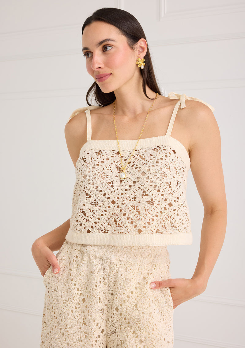 Alivia Kendra Top Seastar Crochet in cream, front view on model, square neckline, tie straps, open crochet pattern.