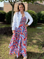 Printed Tiered Maxi Dress featuring bold geometric pattern, smocked bodice, and flowing tiered skirt.