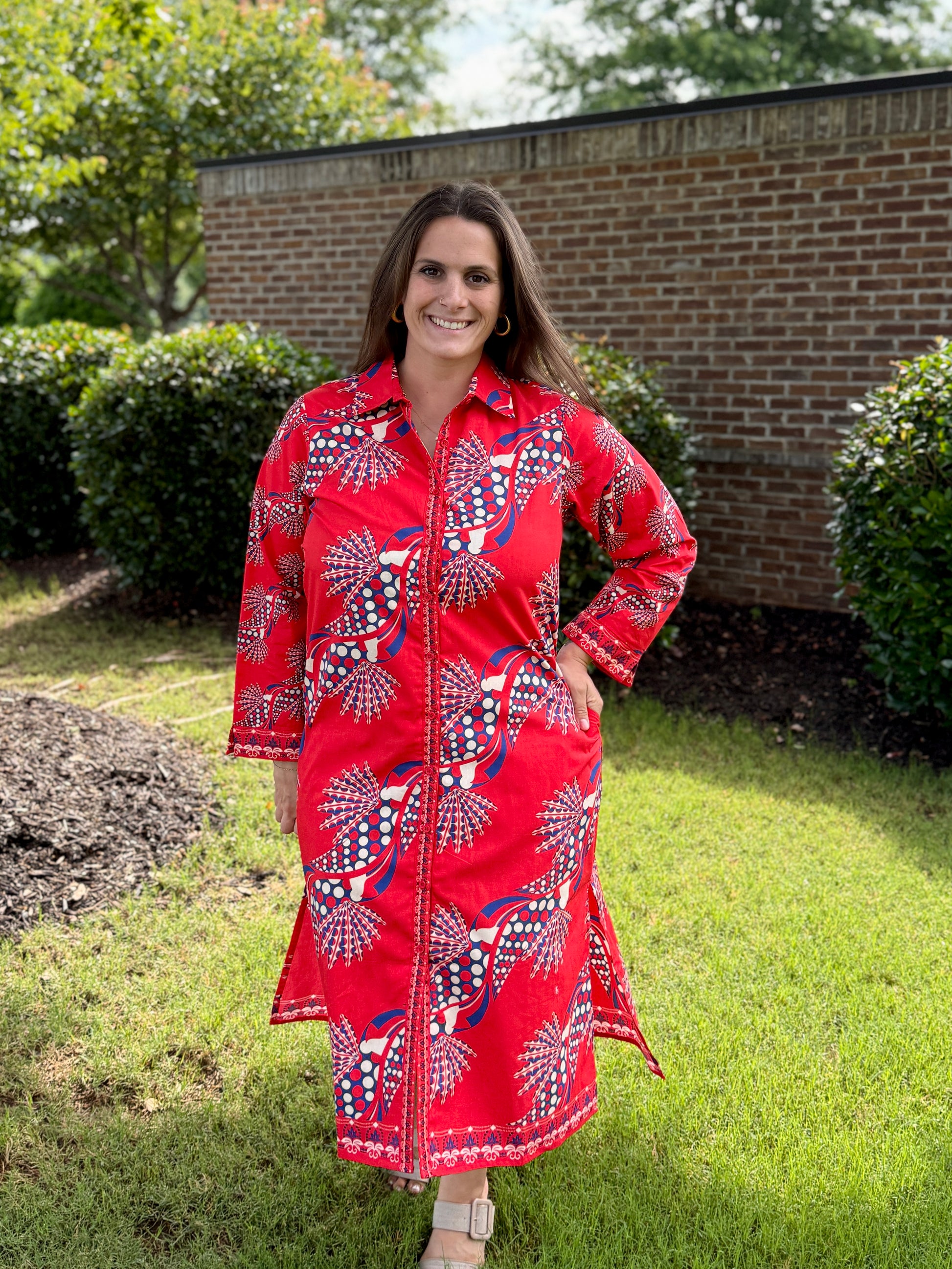 Maude Vivante Eliza long-sleeve red printed shirtdress with blue and white abstract fan motif pattern.