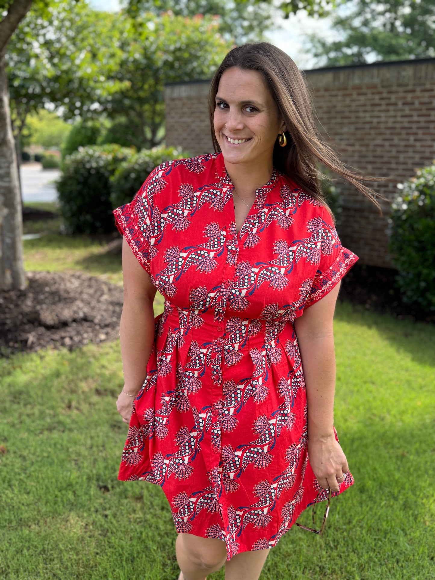 Maude Vivante Yana Dress in red with navy and white floral fan print, short sleeves, button-front style.