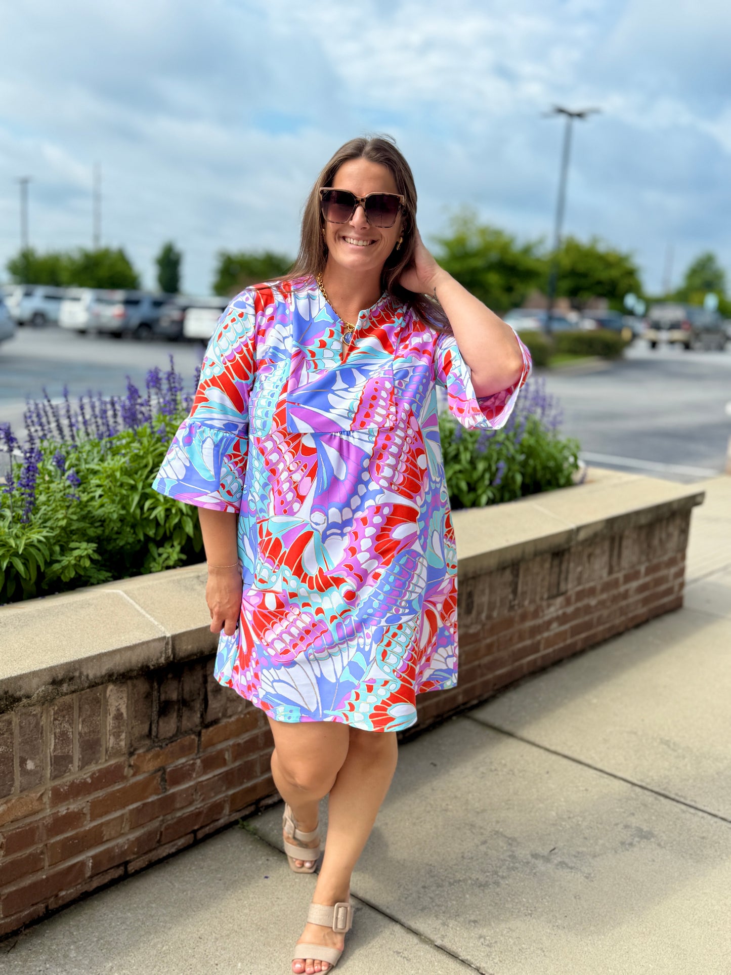 Jude Connally Kerry dress featuring a vibrant butterfly mosaic print, bell sleeves, and knee-length silhouette.