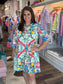 House of MBR Mint Chinois Shirt Dress Short featuring pink birds, florals, and lemons on mint green, worn by model, front view.