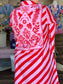 Maude Vivante Sophia Scarlet Slash Dress featuring diagonal red and pink stripes with a tropical floral bandana-print back...