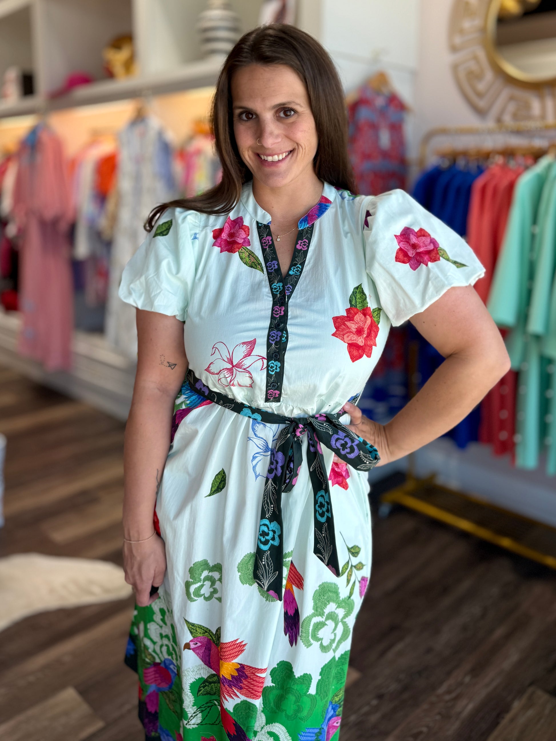 Maude Vivante Nova Dress Forest Flutter — white midi dress with colorful floral and bird embroidery, black belted waist, s...