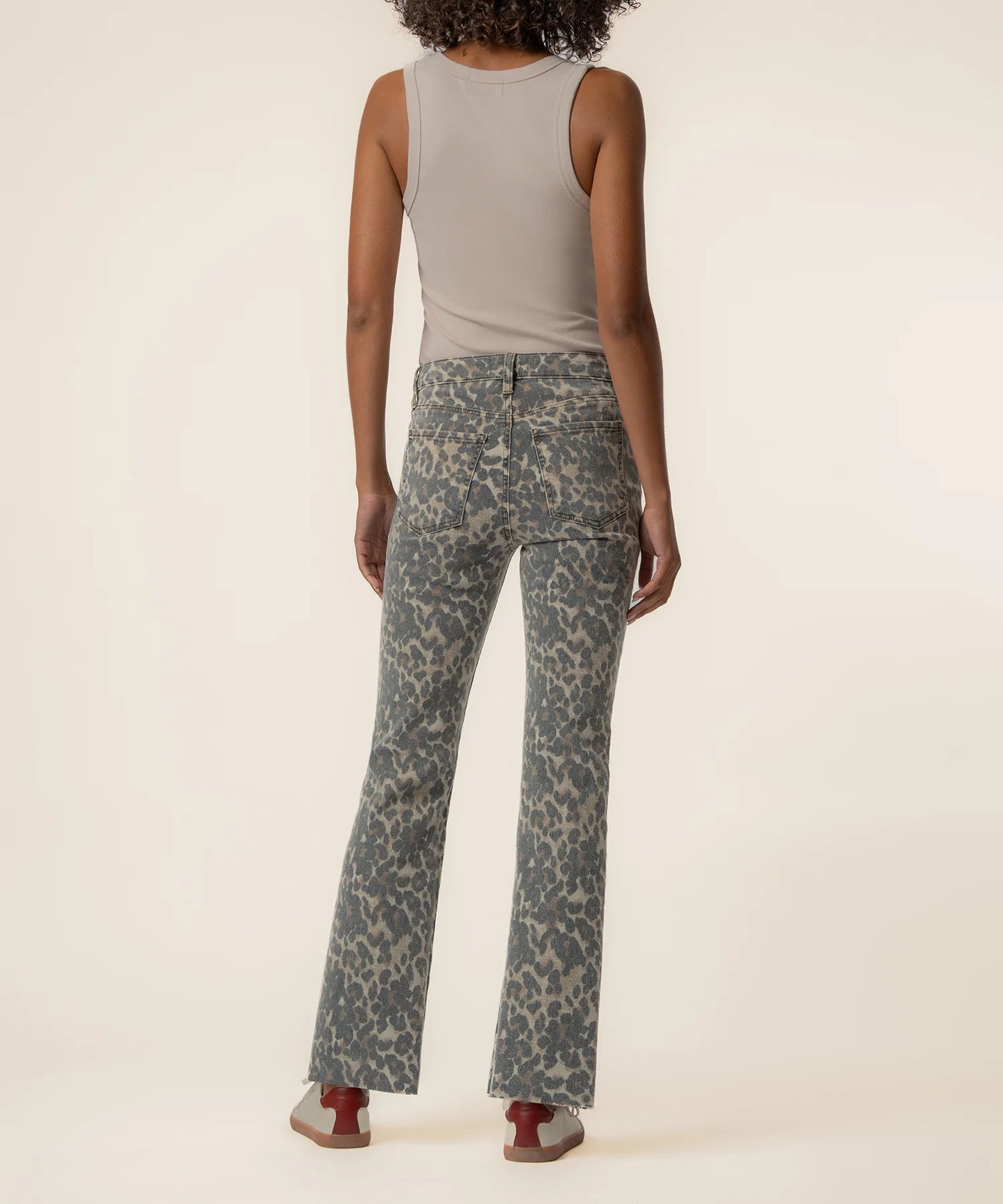 Kut Kelsey High Rise Ankle Flare jeans in gray leopard print, back view on model paired with a beige tank top.