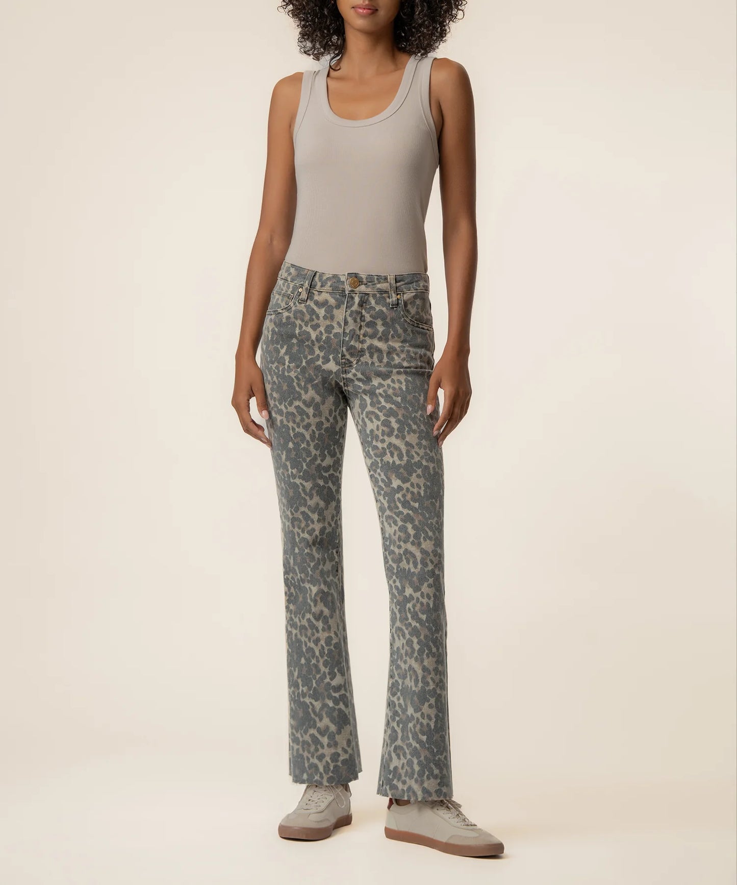 Kut Kelsey High Rise Ankle Flare jeans in blue-gray leopard print, worn with gray tank top and sneakers, front view.