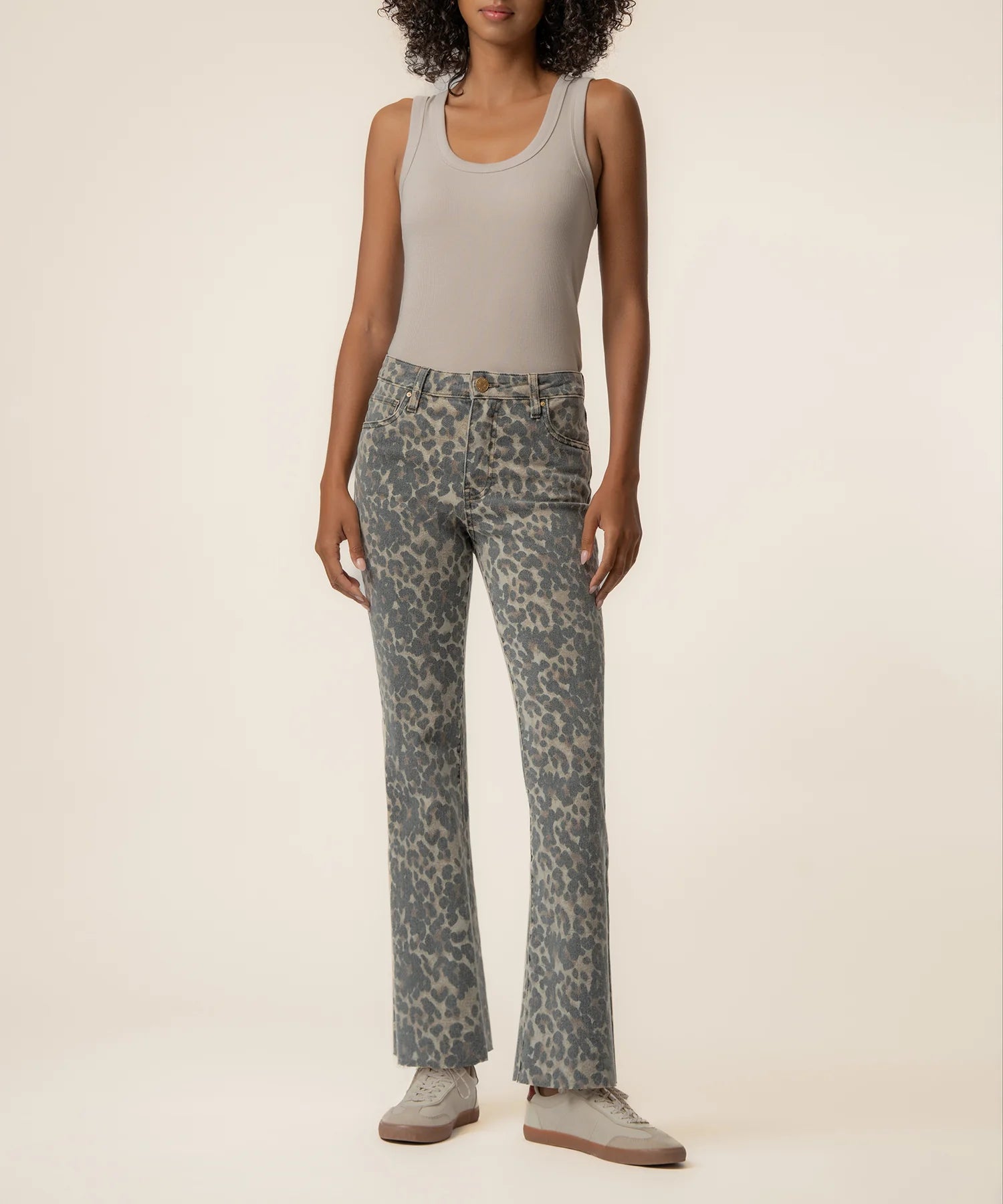 Kut Kelsey High Rise Ankle Flare jeans in blue-gray leopard print, worn with gray tank top and sneakers, front view.