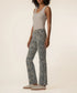 Kut Kelsey High Rise Ankle Flare jeans in blue-grey leopard print, side view on model with grey tank top and sneakers.